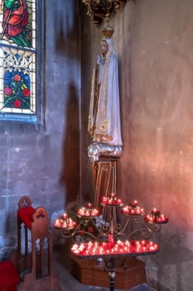 Sacrificial candles with Saint Mary, St. Martin Church, Amberg, Upper Palatinate, Bavaria, Germany