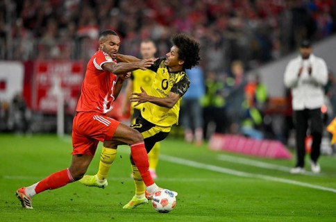 Duel, action Jonathan Tah FC Bayern Munich FCB (04) against Karim Adeyemi Borussia Dortmund BVB