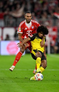 Duel, action Jonathan Tah FC Bayern Munich FCB (04) against Karim Adeyemi Borussia Dortmund BVB