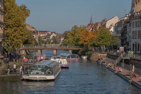 Tourist boat docks on the Ill and transports visitors who enjoy the view of Strasbourg's sights and