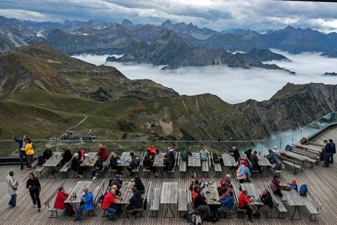 Restaurant at the Nebelhorn summit with views of the Allgäu Alps, mountains rising from fog in the