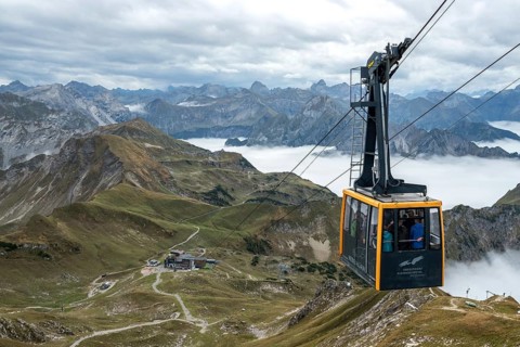 View from Nebelhorn summit to Nebelhorn cable car cabin, mountains of the Allgäu Alps behind,