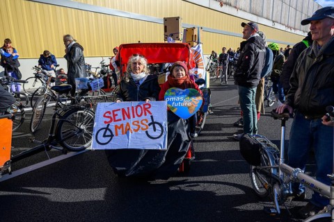 Senior women from Senior Mass and Grandmas for Future in bicycle rickshaw on A100 at a demo on the