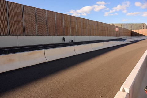 A man urinates next to his bicycle on the A100 during the bicycle demo on the recently inaugurated