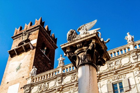 Column with the Lion of Saint Mark and Palazzo Maffei in the backgound at Piazza delle Erbe.
