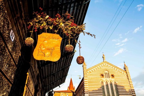 Detail of the front of a café in the historic center of Verona. Verona, Province of Verona, Italy.