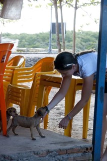Woman Playing with Dog, Alcântara, Maranhão, Brazil