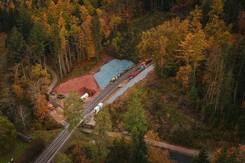 Railway tunnel construction in an autumn forest environment seen from the air, Hermann-Hesse-Bahn