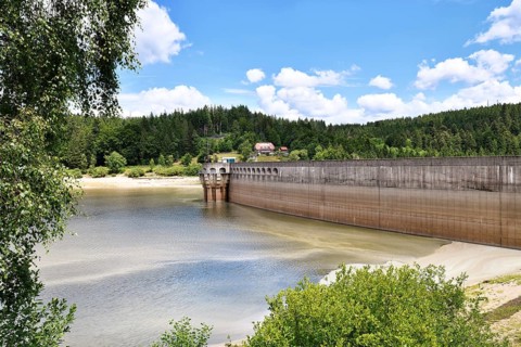 Dam at lake in the Black Forest in Forbach in Germany called Schwarzenbach Reservoir under a clear