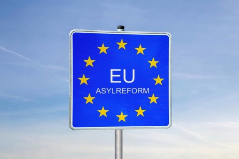 (photo montage) Border sign with the inscription EU ASYLUM REFORM