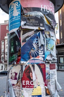Advertising column for cultural projects, advertising for events, unkempt, torn and exfoliated