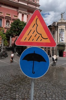 Signs on artificial rain system on Prešeren Square, umbrella, Ljubljana, Slovenia