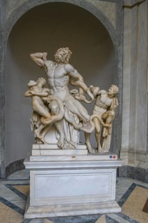 Photo of original ancient marble sculpture Laocoon group of priests Laocoon and his sons fighting