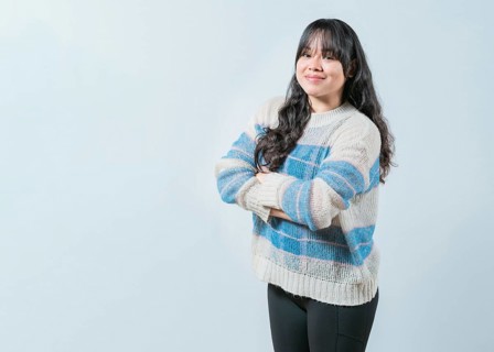Portrait of beautiful and smiling Asian woman on isolated background. Young Asian female with