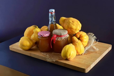 Still life with quinces, homemade quince jelly and quince liqueur, autumn, Germany