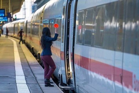 ICE train ready for departure, train staff waiting for the signal to continue, at Essen main