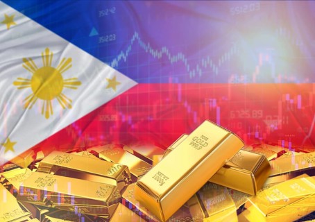 Gold bars on Philippines flag in background. Gold bars stacked on Filipino flag. Concept of