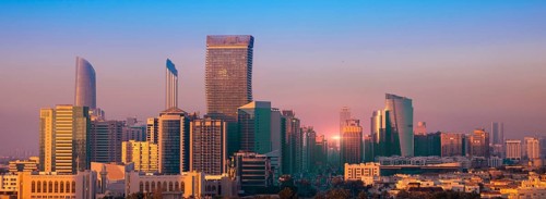 UAE, United Arab Emirates, Abu Dhabi downtown panorama and financial center skyline at sunset