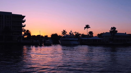 Yachts and sailboats in Fort Lauderdale canals in Florida at sunset