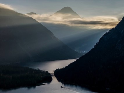 Mountain lake, mountains, sunrays, back light, fog, boat, sightseeing boat, evening light, Plansee,