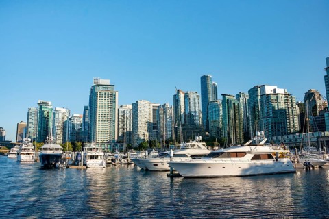 Sailing boats in marina, skyscrapers on the promenade, Coal Harbour, Vancouver, British Columbia,