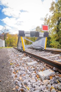 Rail end with barrier against autumn background and blue sky, ZOB Calw, Hermann Hessebahn, Calw,