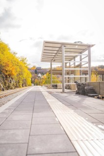 Abandoned platform in autumn with yellow trees and modern construction, ZOB Calw, Hermann