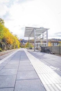 Empty train station in autumn surroundings with modern architecture and sunny weather, ZOB Calw,