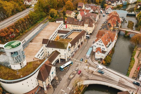 Urban crossroads in autumn, aerial view showing roads, bridges and river, ZOB Calw, Hermann