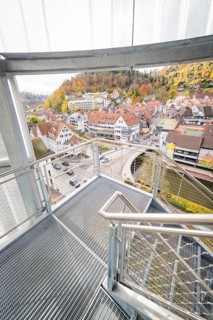 Glass staircase with view of autumnal town and hilly landscape, ZOB Calw, Hermann Hessebahn, Calw,