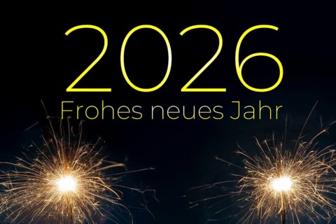 New Year's Eve greetings 2026: greeting card with sparklers against a dark blue background and the