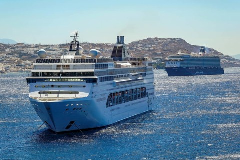 Mykonos, Cyclades, Greece - Cruise ships MEIN SCHIFF 5 and MSC LIRICA are located in the bay off