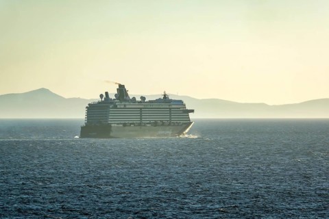 Mykonos, Cyclades, Greece - Cruise ship MEIN SCHIFF 5 sails out of Mykonos harbour bay and leaves