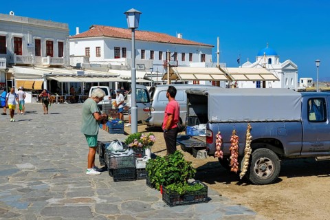 Mykonos, Cyclades, Greece - Vegetable seller sells vegetables, herbs and flowers directly from his