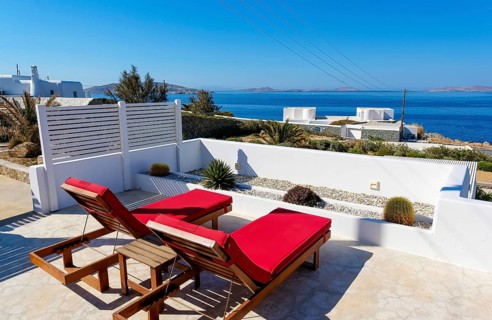 Mykonos, Cyclades, Greece - theme photo: vacation in Greece, sun loungers on the terrace of a