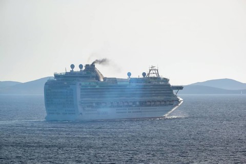 Mykonos, Cyclades, Greece - Cruise ship AZURA from the shipping company P&O Cruises sails out of