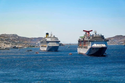 Mykonos, Cyclades, Greece - cruise ships CARNIVAL MIRACLE and COSTA FORTUNA are located in the bay