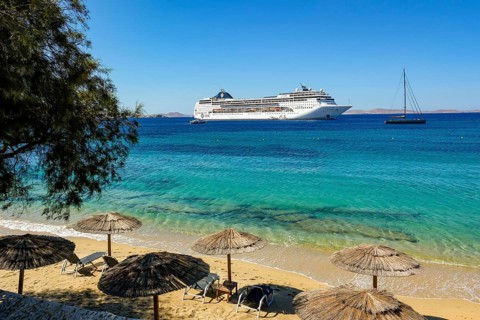 Mykonos, Cyclades, Greece - Cruise ship MSC Lirica is located in Mykonos Harbour Bay. Cruise ships