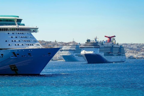 Mykonos, Cyclades, Greece - Cruise ships are moored in the harbour bay, Mykonos New Port, in front