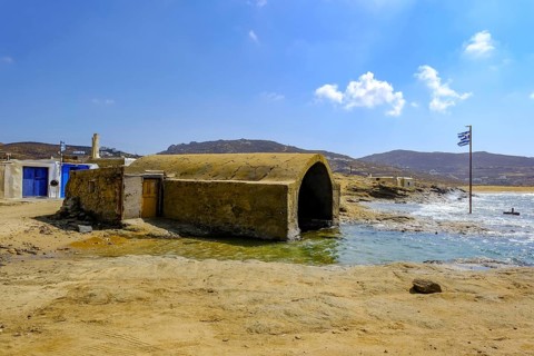 Mykonos, Cyclades, Greece - Ftelia Beach, fishing lodge on Ftelia beach, sandy beach on windy rocky