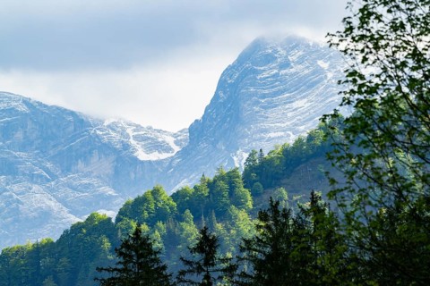 View into the mountains next to Lake Almsee on a rainy day in spring, Traunstein summit,