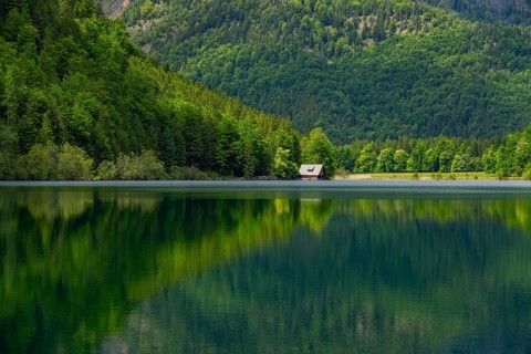 Landscape of Lake Offensee after rain when the sun comes through the clouds in spring,