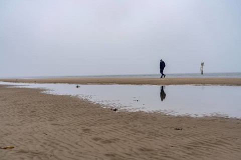 East beach of the East Frisian island of Spiekeroog, beach walk, man alone on the beach, at low