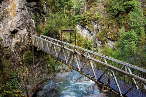 Wooden bridge over the mountain river Diosaz in the gorge, Gorges de la Diosaz, Les Houches,