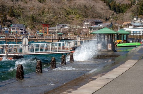 Water splashes on the waterfront of Lake Ashi in Motohakone, Hakone, Japan