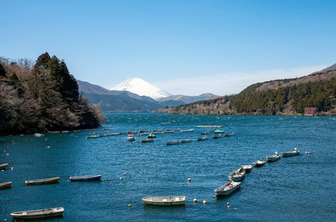 Attached rowing boats, view of Lake Ashi with Mount Fuji volcano, Hakone, Japan
