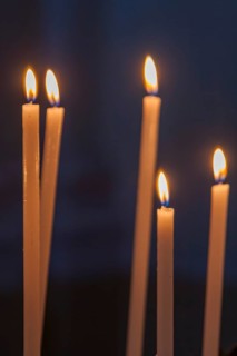 Sacrificial candles in a church, Tuscany, Italy