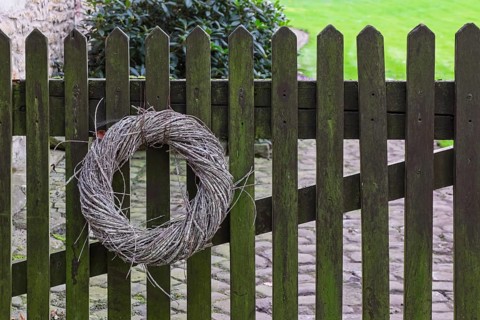 Wreath made of natural materials on an old wooden fence, Münsterland, North Rhine-Westphalia,