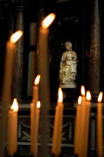 Prayer candles and Bruges Madonna, sculpture by Michelangelo from 1501 to 1506, Moscron chapel of