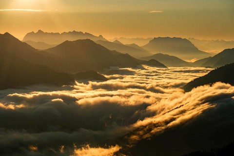 Silhouette of mountains at dusk, fog in the valley, Wilder Kaiser and Chiemgau Alps, Upper Bavaria,